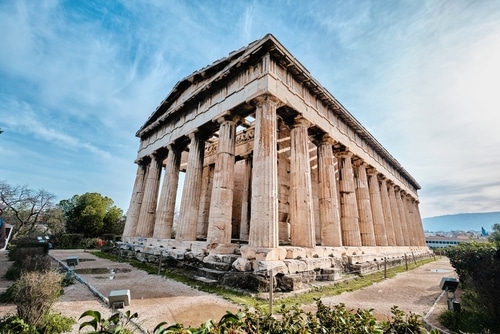 The Temple of Hephaestus surrounded by greenery in Athens, Greece.