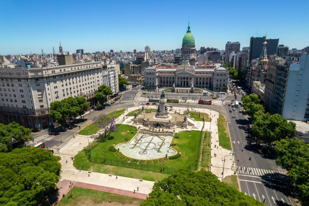 A panoramic view of Buenos Aires with historic landmarks and lively streets.