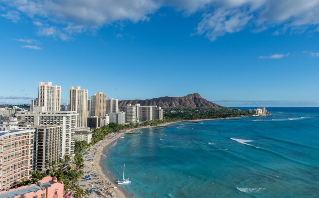 Scenic view of Honolulu’s beaches and cityscape with Diamond Head in the background.